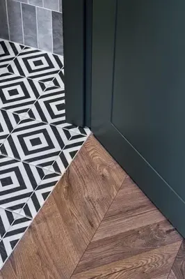 a room with a door and a wooden floor at Old-New Apartment in Central Kaunas in Kaunas