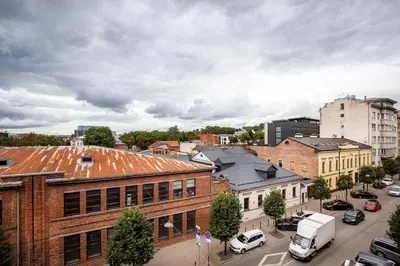 a view of a city with cars parked on a street at Old-New Apartment in Central Kaunas in Kaunas