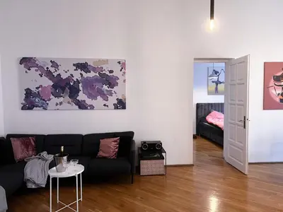 a living room with a couch and a table at Old Town home of Evil Dog in Vilnius