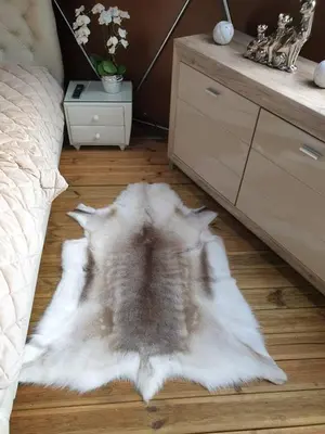 a white rug on the floor of a bedroom at kupolas in Šiauliai