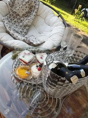 a glass table with a tray of food on a table at kupolas in Šiauliai