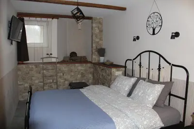 a bedroom with a bed and a television in it at Old Town Apartment with a separate entrance in Kaunas
