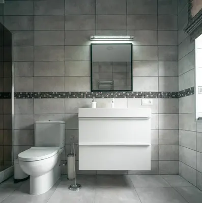 a bathroom with a toilet and a sink and a mirror at Laurentroom Center in Ukmergė
