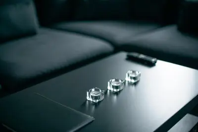 a table with two engagement rings and a laptop at Laurentroom Center in Ukmergė