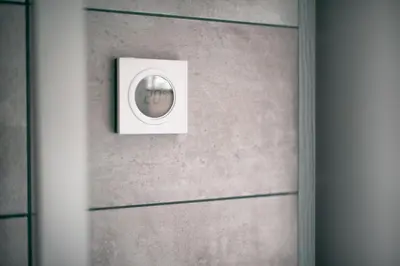 a door with a light switch on a wall at Laurentroom Center in Ukmergė