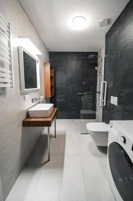 a bathroom with a sink and a toilet at Modern Apartment Next to Kaunas Castle in Kaunas
