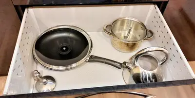 a set of pots and pans in a box at M&M Apartment VIII Self CHECK-IN in Panevėžys