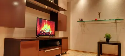 a television sitting on a stand in a room at M&M Apartment VIII Self CHECK-IN in Panevėžys