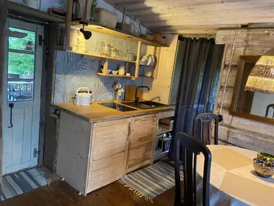a kitchen with a sink and a counter top at Vienkiemio Oazė - Namelis Prie Šermukšnio in Galvokai