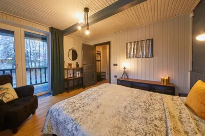a bedroom with a large bed and a couch at 