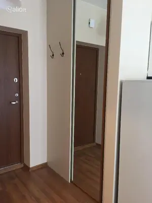 a hallway with two doors and a mirror in a room at Near PANORAMA apartment Self check-in Garage free in Vilnius