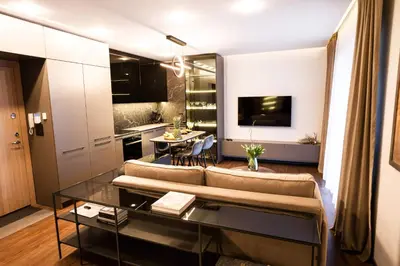 a living room with a couch and a table at Stay in Kaunas & Park House in Kaunas