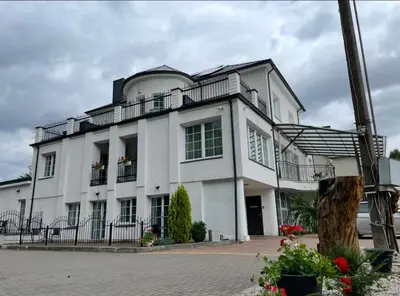 a large white building with a balcony at La-Vanda in Šiauliai