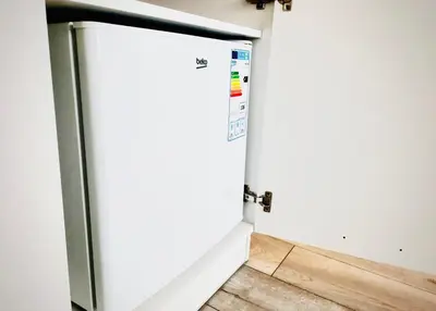a door in a room with a wooden floor at M&M Apartment VII Self CHECK-IN in Panevėžys