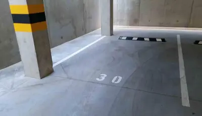 a concrete floor with the number three on it at Ozas Green Apartment in Vilnius