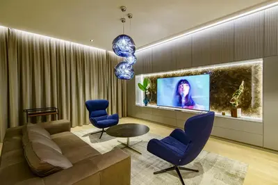 a living room with a couch and chairs and a tv at Luxury Smart Home Apartment in Vilnius Old Town, Sleep on Hästens in Vilnius