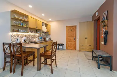 a kitchen with a table and chairs in a room at Calm and private apartment by Polo Apartments in Kaunas