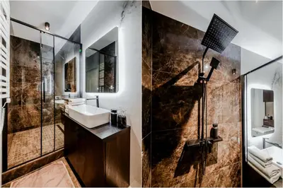 a bathroom with a sink and a shower at Old Town apartment l Self check in in Vilnius