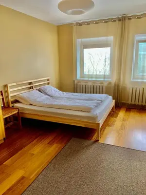 a bedroom with a bed and a window at Comfortable Stay in Siauliai in Šiauliai