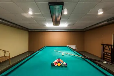 a billiard room with a pool table at ORO Dubingiai in Giraičiai