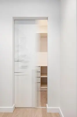 an open door into a room with white walls and wood floors at HaPPy Inn G, Self check-in, Terrace, Underground Parking in Vilnius