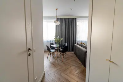 a living room with a couch and a table at Cozy Apartment In Kaunas Center in Kaunas