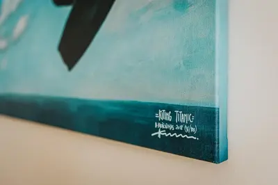 a book sitting on top of a wall at Wonderful Apartment In The Heart Of Kaunas Center in Kaunas