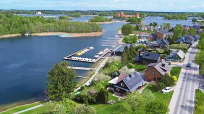 an aerial view of a small town on a lake at Augutės Zurlienės apartamentai in Trakai