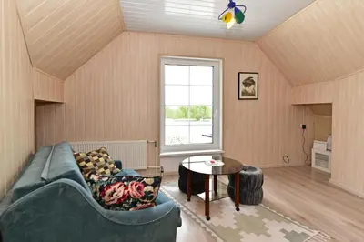 a living room with a couch and a table at Augutės Zurlienės apartamentai in Trakai