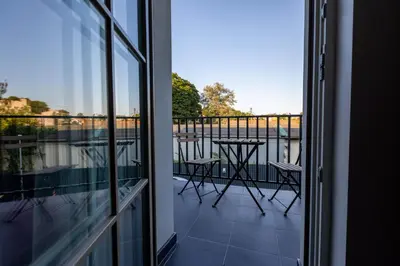 a balcony with a view of a table and chairs at Vilnius legends house I Best for families I Free parking in Vilnius