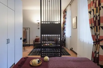 a hallway with a living room with a fireplace at ROOMA Apartments Boutique Old Town Self Check-in in Vilnius
