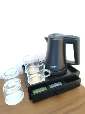 a coffee maker sitting on top of a table at St Casimir Apartments in Vilnius