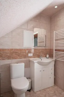 a bathroom with a toilet and a sink at Laurentroom Oldtown in Ukmergė