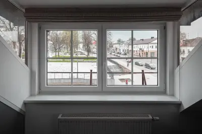 a window with a view of a city street at Laurentroom Oldtown in Ukmergė