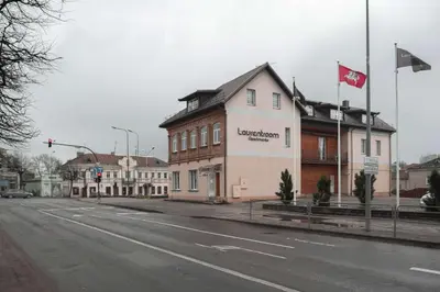 a building on the corner of a street at Laurentroom Oldtown in Ukmergė