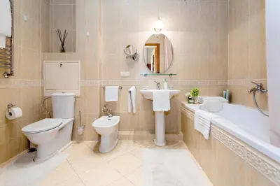 a bathroom with a toilet and a sink and a tub at Vilnius Apartments & Suites – Old Town in Vilnius