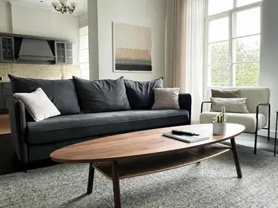 a living room with a couch and a coffee table at Vilnius Apartments & Suites – Old Town in Vilnius