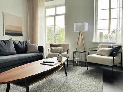 a living room with a couch and a coffee table at Vilnius Apartments & Suites – Old Town in Vilnius