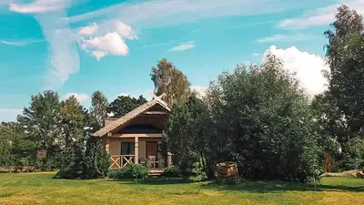 a small house in the middle of a field at PO NENDRIŲ STOGU in Šiauliai
