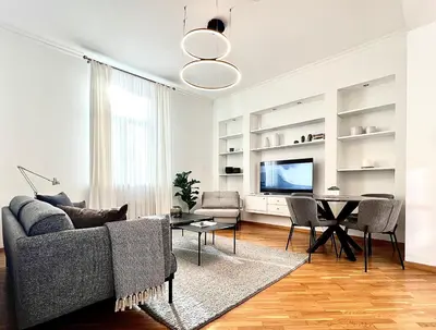 a living room with a couch and a table at Vilnius Apartments & Suites - Town Hall in Vilnius