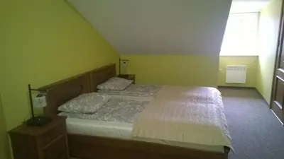 a bedroom with a bed and a window at Guest house 