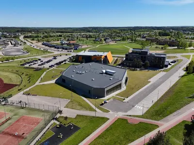 an aerial view of a building with a parking lot at Guest house 