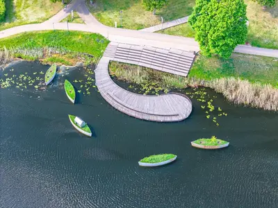a walkway in the middle of a body of water at Guest house 