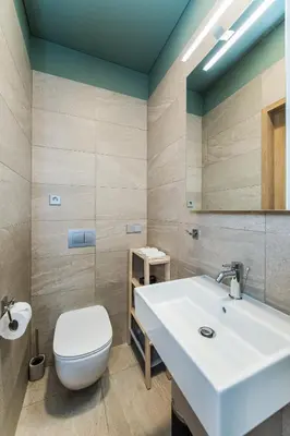 a bathroom with a sink and a toilet at River city apartments in Kaunas
