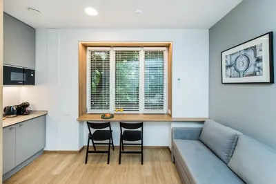 a living room with a couch and a table at River city apartments in Kaunas