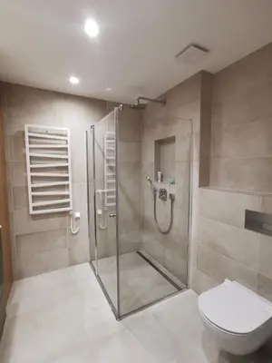 a bathroom with a shower and a toilet at MyCasa CBD in Vilnius