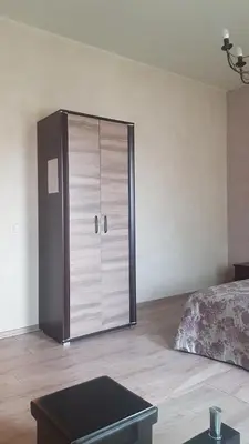 a bedroom with a large closet and a bed at Meldynas in Vabalninkas