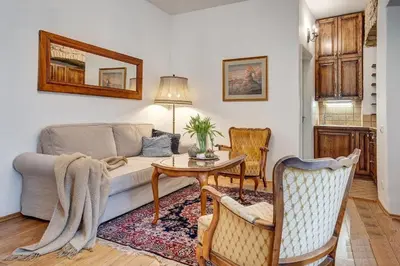 a living room with a couch and a table at Old Town Saviciaus street Apartment in Vilnius