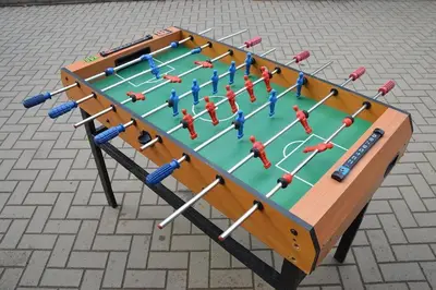 a ping pong table with people on it at Pirtis Prie Neries Jonava in Jonava