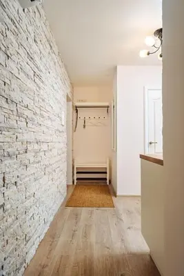 an empty hallway with a brick wall at Domus Fortuna in Vilnius